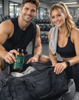 Man and woman in a gym setting with a supplement bottle and bag.