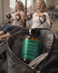 Bottle of 'Vibrant Thyroid Support' supplement in a bag with a woman exercising in the background.
