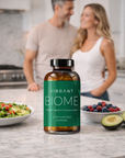 Vibrant Biome supplement bottle on a kitchen counter with a couple in the background