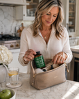 Woman in a kitchen preparing supplements in a beige bag