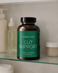 Vibrant Gut Support supplement bottle on a shelf with other products