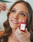 Woman using VIBRANT® DESERT VIBE hydrating serum for dry dehydrated skin