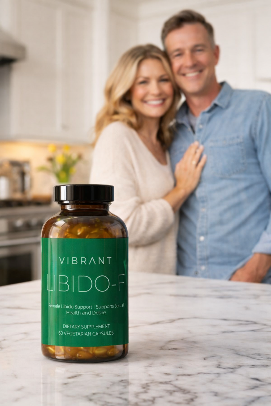 Couple standing in a kitchen with a bottle of Vibrant Libido-F on the counter